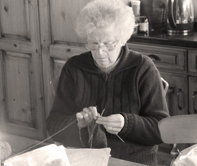 RedCraig's granny, knitting in the kitchen.