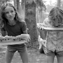 Girls competing in a watermelon eating contest on July 4th: White Springs, Florida | EvinOK.com
