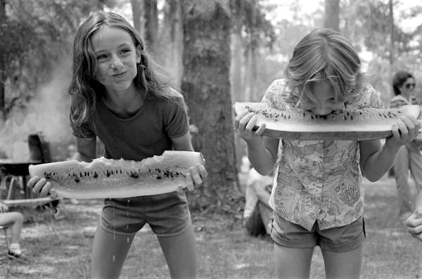 Girls competing in a watermelon eating contest on July 4th: White Springs, Florida | EvinOK.com