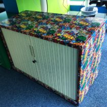 decoupaged file cabinet with Avengers wrapping paper | EvinOK