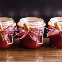 cranberry chutney in jars with cinnamon sticks tied with festive bows