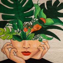 Mural of a face with plants coming out of the top of the head. Photo by ashkan forouzani
