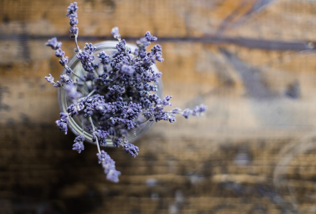 A jar of lavender on a wood table. Photo by Heather Ford